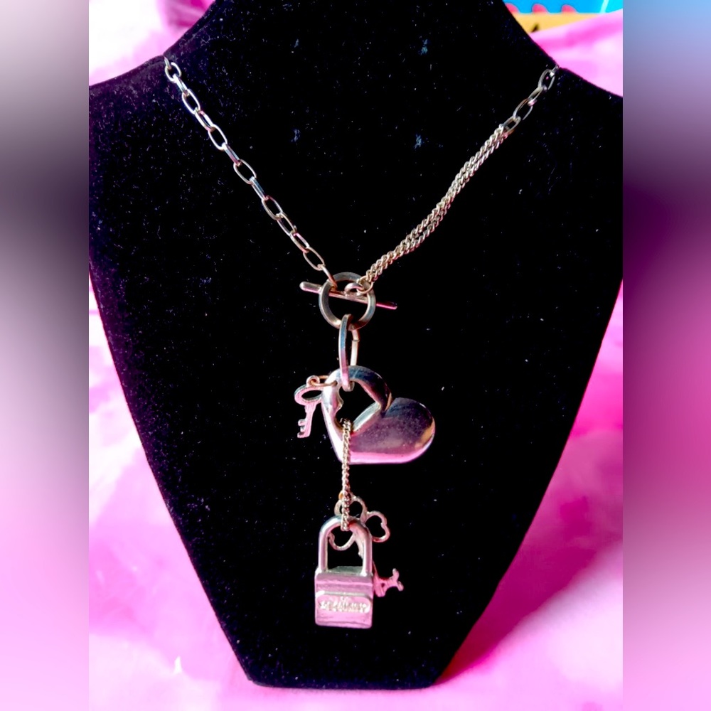 Silver tone charm necklace